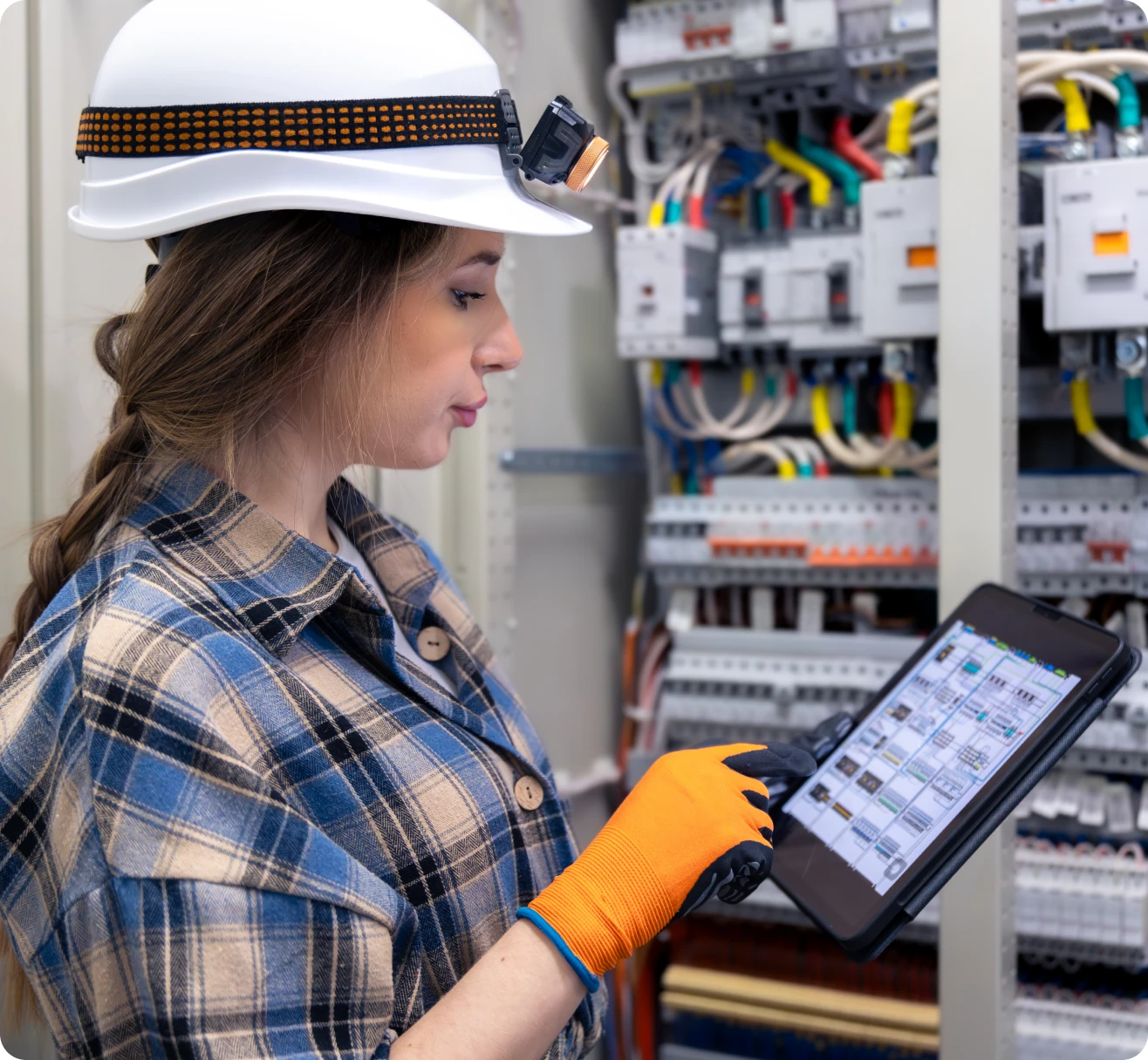 Technician inspecting electrical equipment