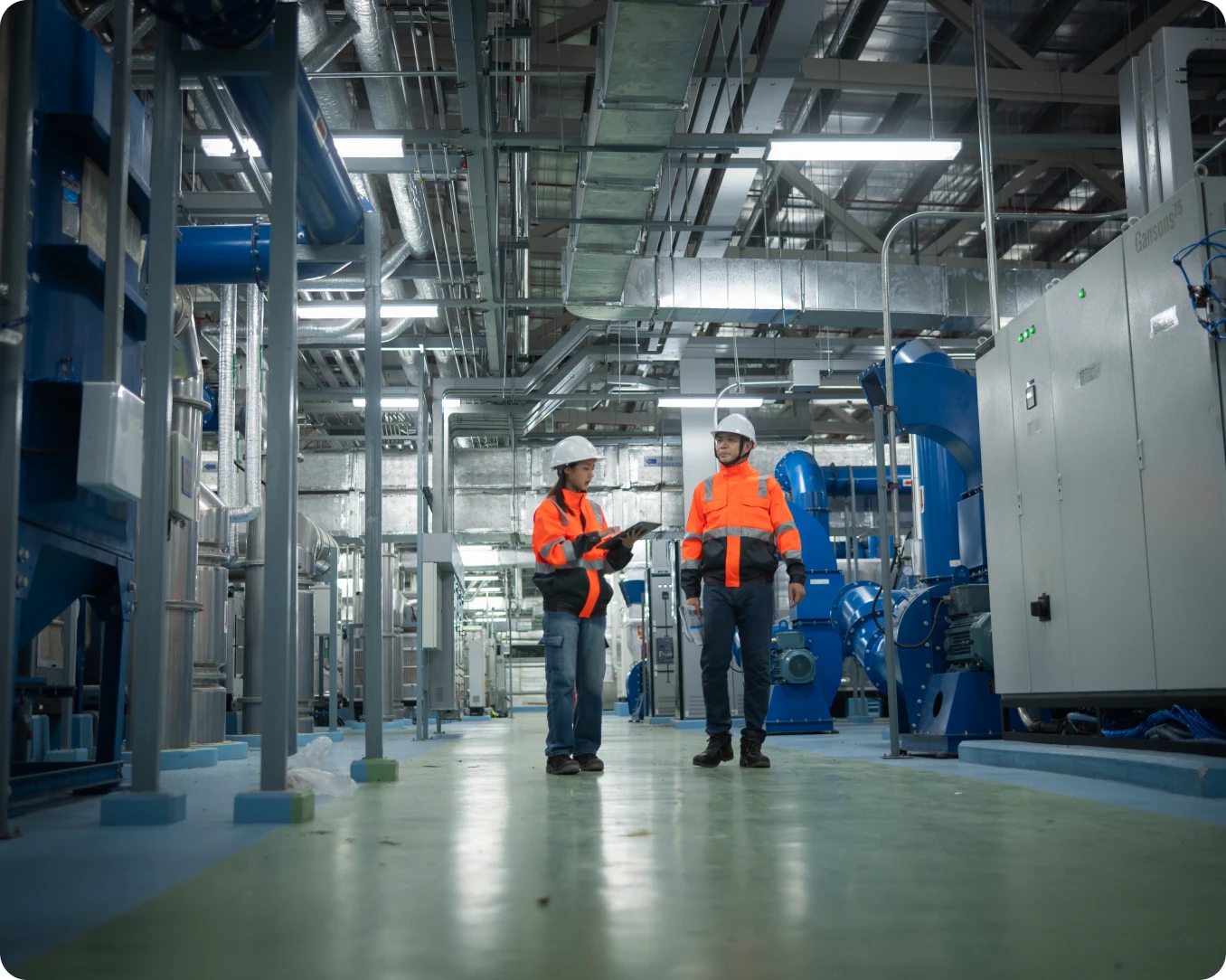 Industrial plant with two people conversing