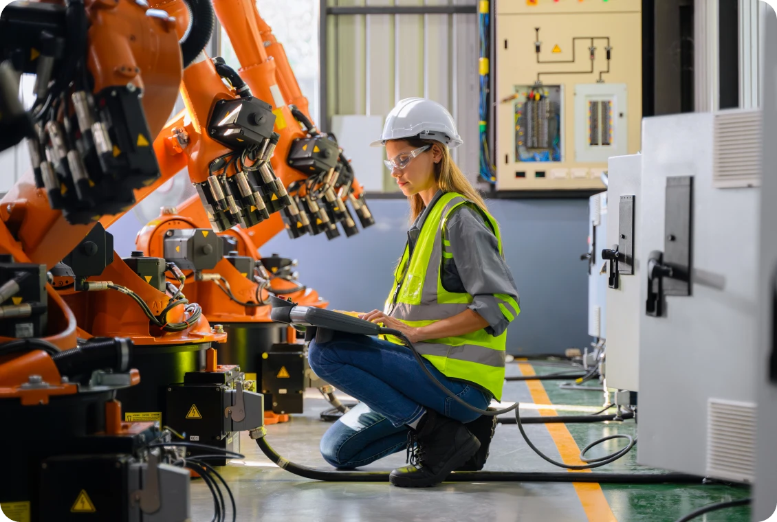 Technician inspecting industrial machinery